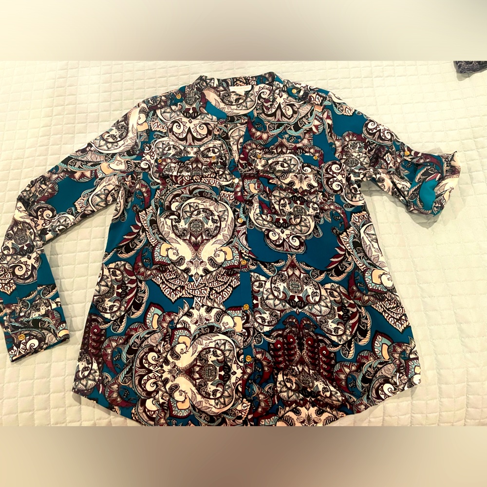 Beautifully patterned blouse.